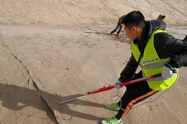 Inspection of the integrity of the impermeable layer damage of the solid waste and waste residue disposal landfill